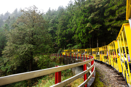 Yilan, Taiwan 05 December 2023: Yellow Colored Bong Bong Train in Taipingshan National Forest Recreation Area at Yilanのeditorial素材