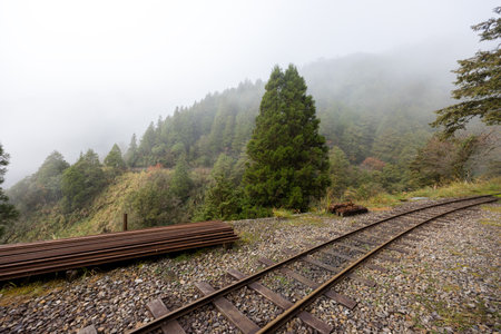Train track in foggy mist on the mountain