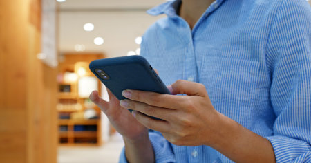 Close up of woman use of mobile phoneの写真素材