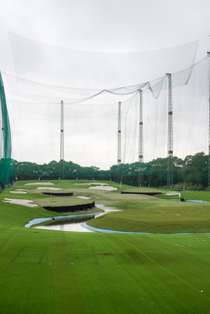 Golf driving range made of large green wire meshの写真素材