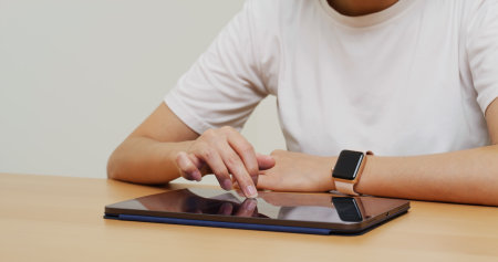 Woman working on tablet computerの写真素材