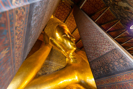 Reclining Buddha figure in Wat Pho Buddhist templeの写真素材
