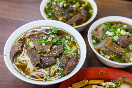 Braised beef noodle soup in restaurantの写真素材