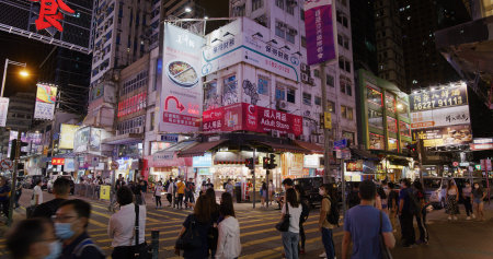Mong Kok, Hong Kong 01 April 2021: Pedestrian walk at city street in Hong Kong at nightのeditorial素材