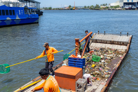 Taiwan 25 August 2022: Collect the trash on the ship over the seaのeditorial素材