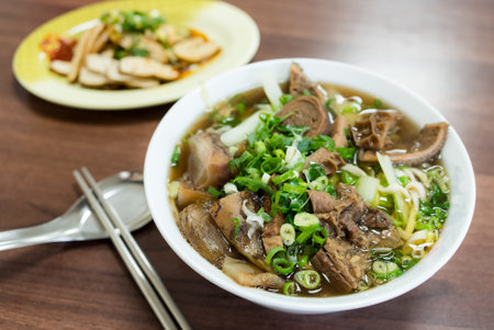 Braised beef noodle soup in restaurantの写真素材