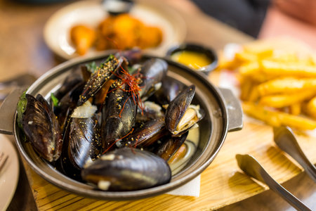 Delicious mussels with herb and sauceの写真素材