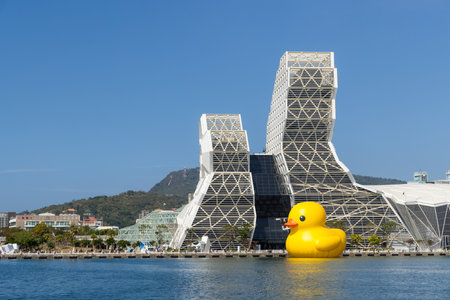 Taiwan, 01 February 2024: Kaohsiung Music Center with yellow duck floating over the bayのeditorial素材