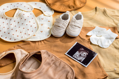 Ultrasound photo with new born baby clothingの写真素材