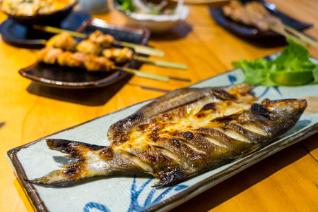 Grilled fish on the plateの写真素材