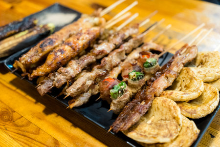 Variety of meat skewers on dishの写真素材