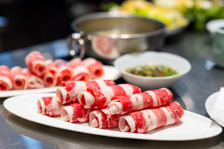 Row of beef in hotpot restaurantの写真素材