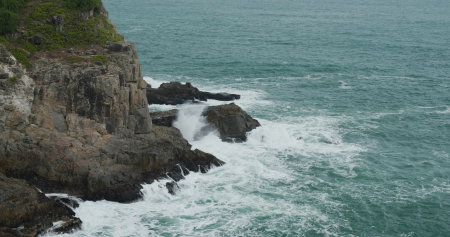Sea wave splash on the rockの写真素材