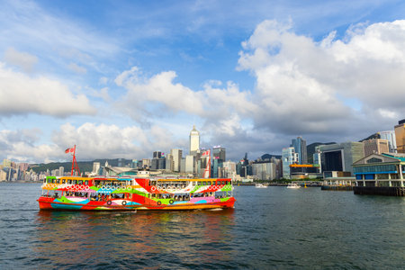 Hong Kong 21 June 2023: Hong Kong ferry cross the Victoria Harborの写真素材