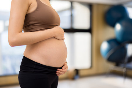 Pregnant woman doing yoga exercisesの写真素材