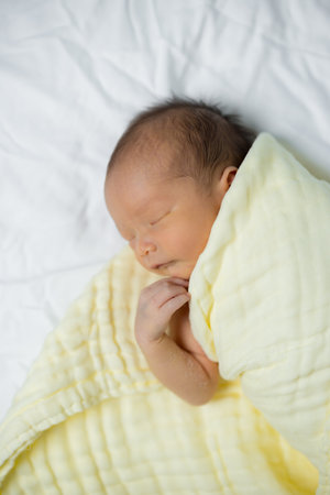 Baby sleep on the bed at homeの写真素材