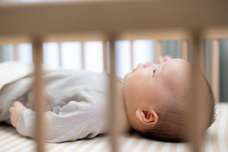 Sleeping baby resting comfortably in baby cot