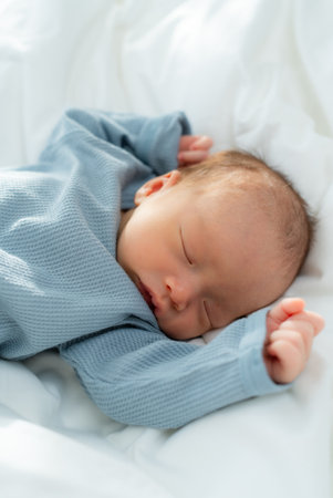Newborn baby sleep on bedの写真素材