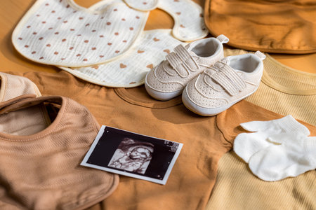 Ultrasound photo with new born baby clothingの写真素材