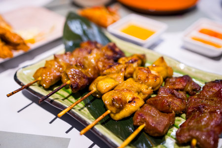 Chicken and pork Skewers in the restaurantの写真素材
