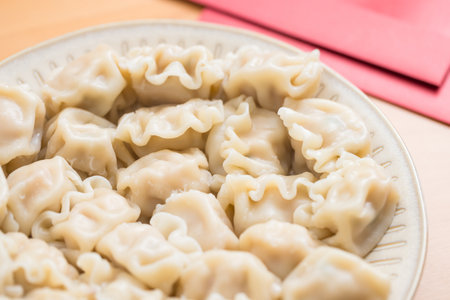 Lunar new year dumplings with red packet traditionの写真素材