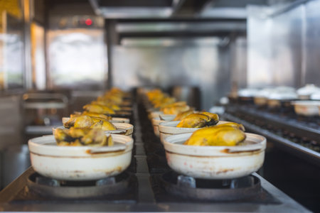 Row of clay pots cooking traditional meal in kitchenの写真素材