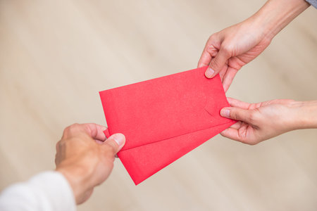 Chinese tradition of giving red envelope happily