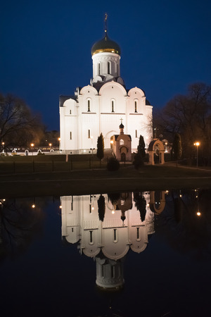 Minsk. Night view on The Church of The Intercession of The Holy Virgin. Reflection in waterの写真素材
