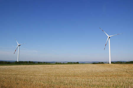 Power generating wind turbines in the countryside. Lot of copy space.の写真素材