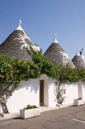 Exterior of traditional trulli houses in Alberobello (Puglia, Italy). These dry-stone houses with conical roofs are characteristic of middle-southern Apulia.の写真素材