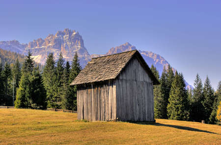 A small, wooden storehouse in italian Alps. HDR image.の写真素材