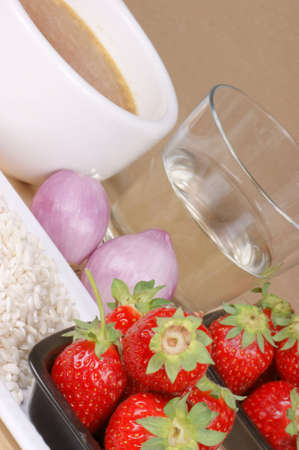 Ingredients for risotto with strawberries: rice, strawberries, shallot, white wine and vegetable stock. Selective focus, shallow DOF.の写真素材