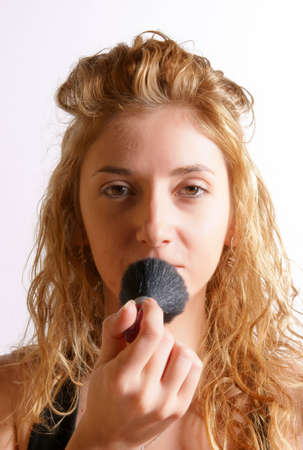 Portrait of a blond young girl with half her face made upの写真素材