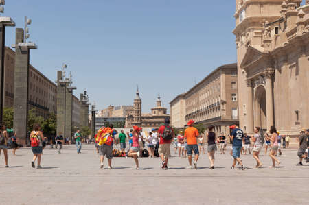 Young spanish pilgrims dancing and singing in Plaza de Nuestra Senora del Pilar in Zaragoza. Hundreds of thousands of pilgrims from all over the world met in Spain on the occasion of the XXVI World Youth Day hosted in Madrid on August 2011.のeditorial素材