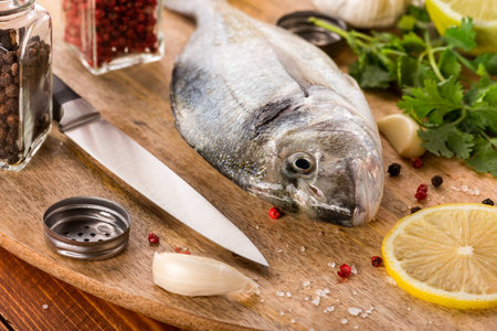 the fish with vegetables on a stone slateの写真素材