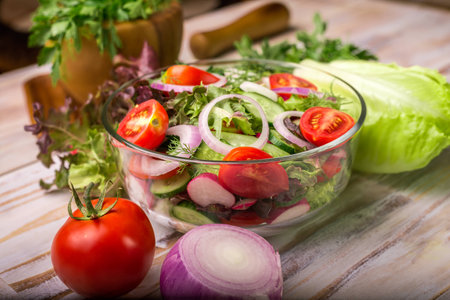 vegetable salad on a the wooden backgroundの写真素材