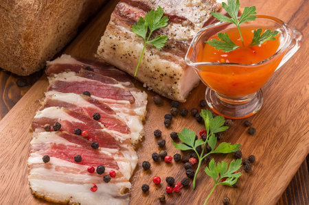 salty bacon on a the cutting boardの写真素材