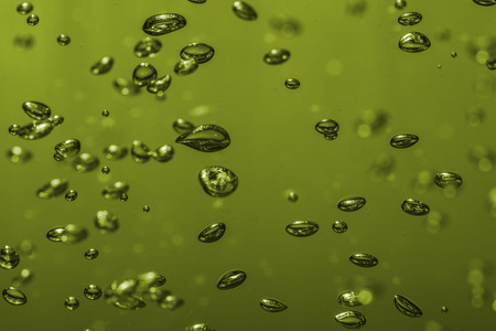 bubbles of different color in the water bright high lightsの写真素材