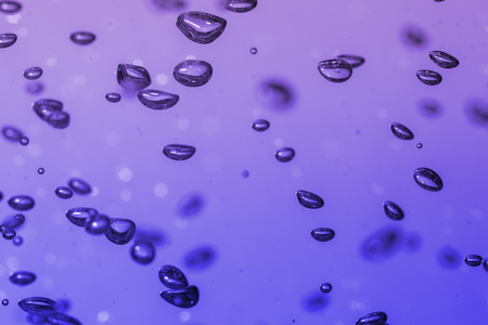 bubbles of different color in the water bright high lightsの写真素材