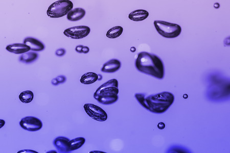 bubbles of different color in the water bright high lightsの写真素材