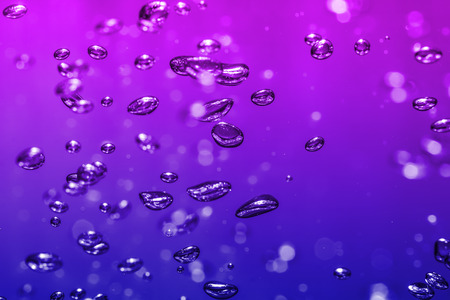 bubbles of different color in the water bright high lightsの写真素材