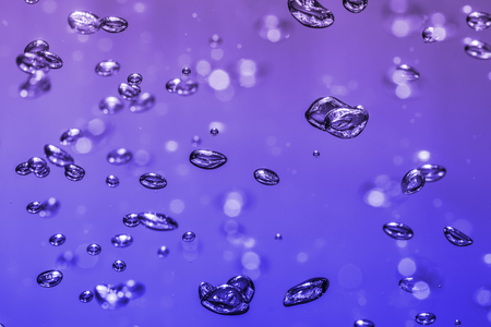 bubbles of different color in the water bright high lightsの写真素材