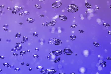 bubbles of different color in the water bright high lightsの写真素材