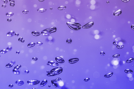 bubbles of different color in the water bright high lightsの写真素材