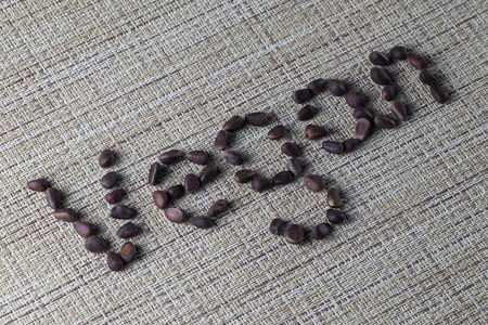 pine nuts on the table close - up with inscriptionsの写真素材