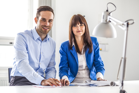 Portrait of young business people working together in officeの写真素材
