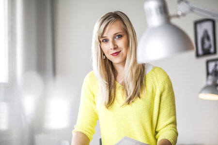 Portrait of beautiful young businesswoman in creative workplaceの写真素材