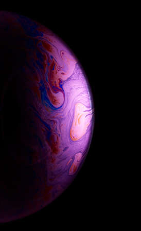Close-up of soap bubble film in various colors