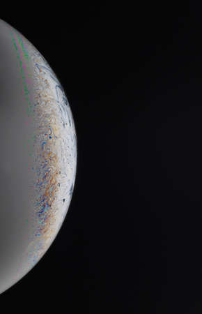 Close-up of soap bubble film in various colors