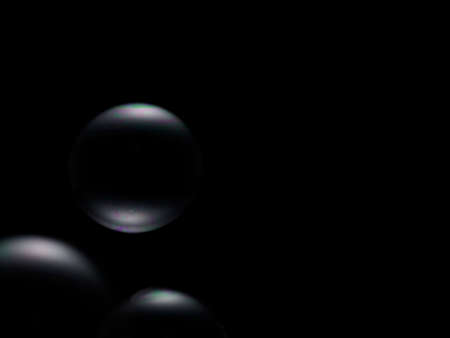 Soap bubble on black backgroundの写真素材